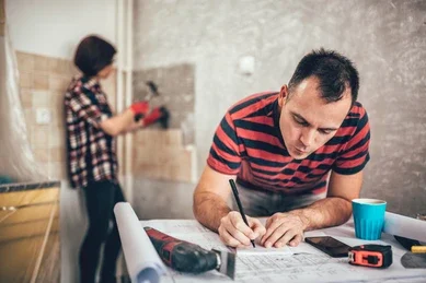 men taking notes renovating kitchen 260nw 1071894515 e1748284724715